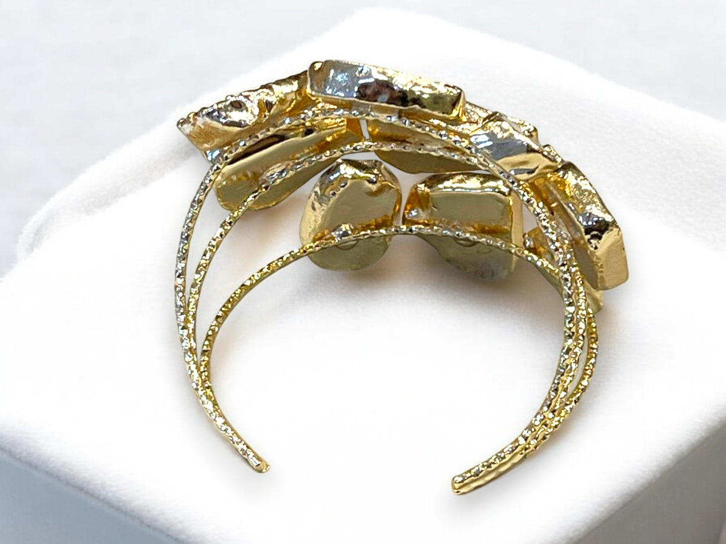 a close up of a bracelet on a white surface