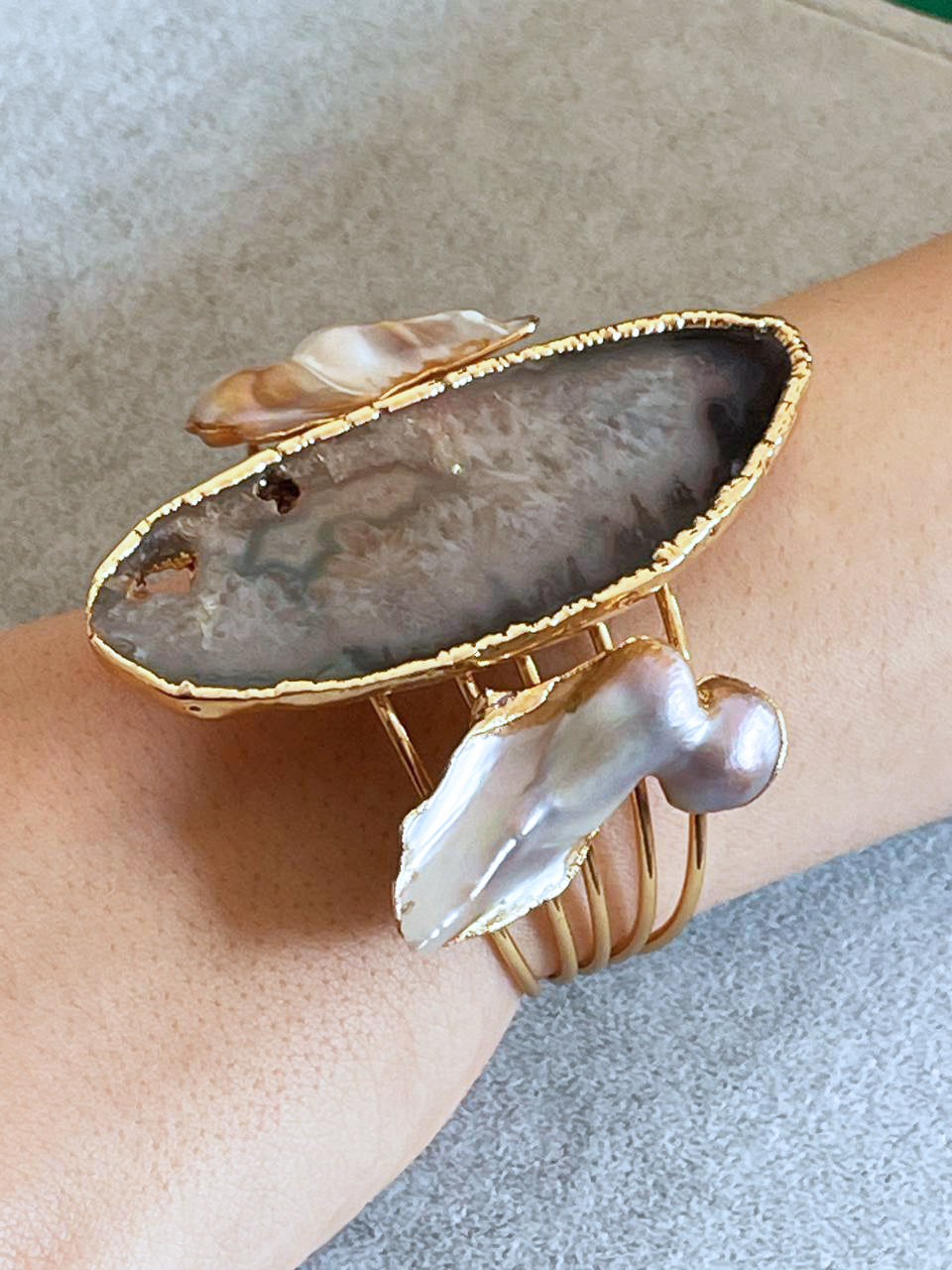 a close up of a person's arm wearing a bracelet