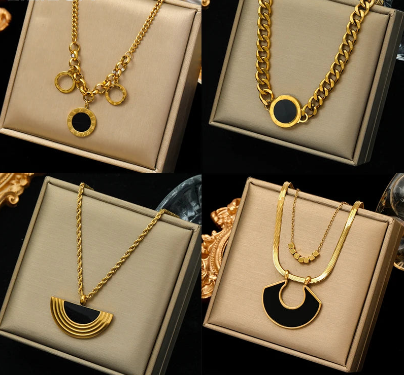 four different types of necklaces in a box