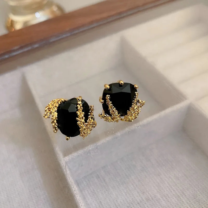 Elegant Black Glass Stud Earrings with Metallic Gold Accents