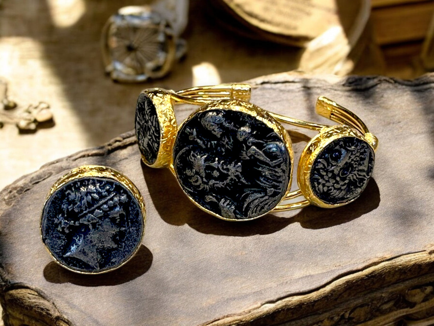 a pair of gold and black cufflinkes on a table