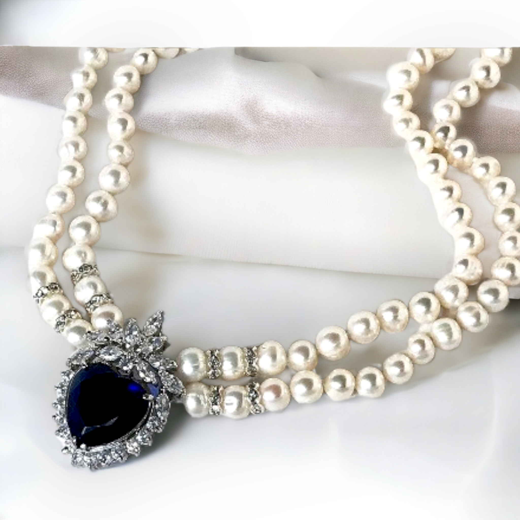 Elegant White Pearl Necklace with Blue Crystal Heart Pendant