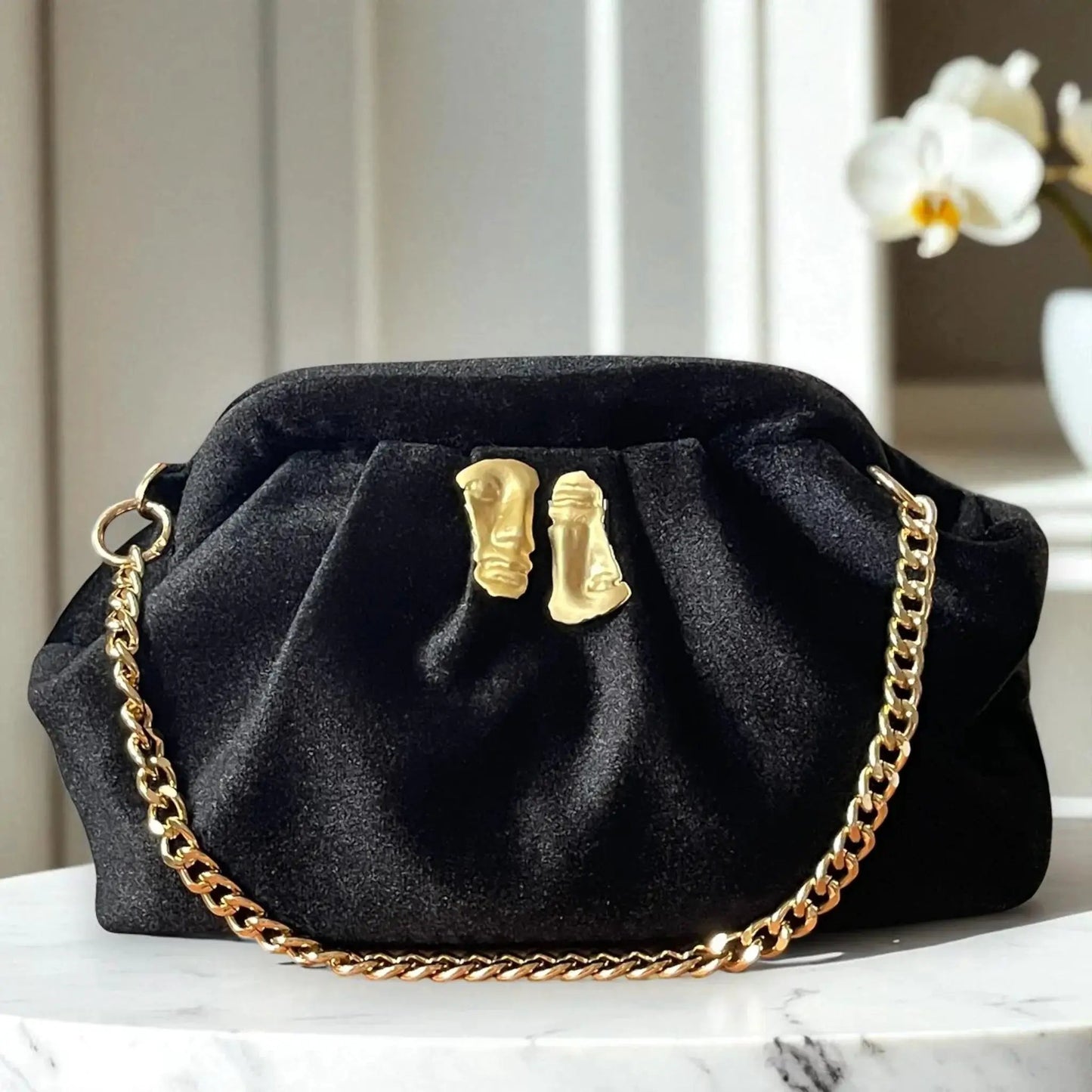 Black Velvet Clutch – Elegant Evening Bag with Gold Sculptural Detail & Detachable Chain Strap by Glam Duchess (black-velvet-clutch-with-gold-face-accent-chain-strap)