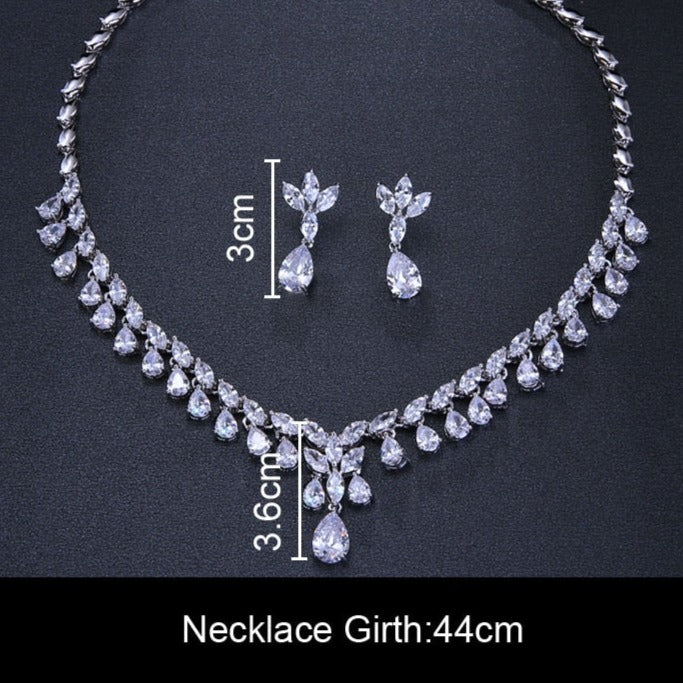 Cubic Zirconia Drop Necklace and Earrings Set with Plant-Inspired Desi
 
 Make a statement at any occasion with this trendy and elegant jewelry set. Crafted from high-quality copper and adorned with sparkling cubic zirconia, this set iGlam DuchessGlam DuchessCubic Zirconia Drop Necklace