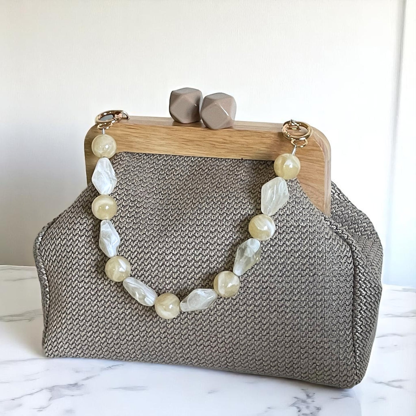 Handmade Beige Woven Clutch Bag with Wooden Frame and Marble Beaded Handle – Elegant Textured Purse for Women - Glam Duchess