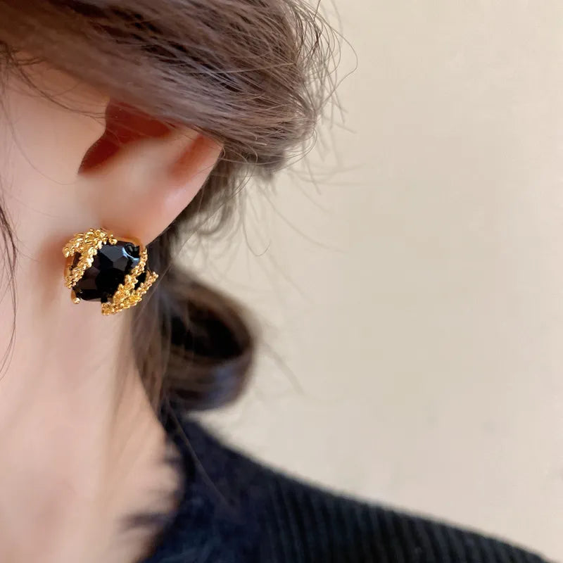 Elegant Black Glass Stud Earrings with Metallic Gold Accents