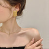 Golden Geometric Tassel Statement Earrings