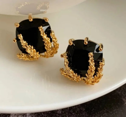 Elegant Black Glass Stud Earrings with Metallic Gold Accents