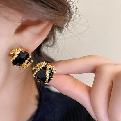 Elegant Black Glass Stud Earrings with Metallic Gold Accents