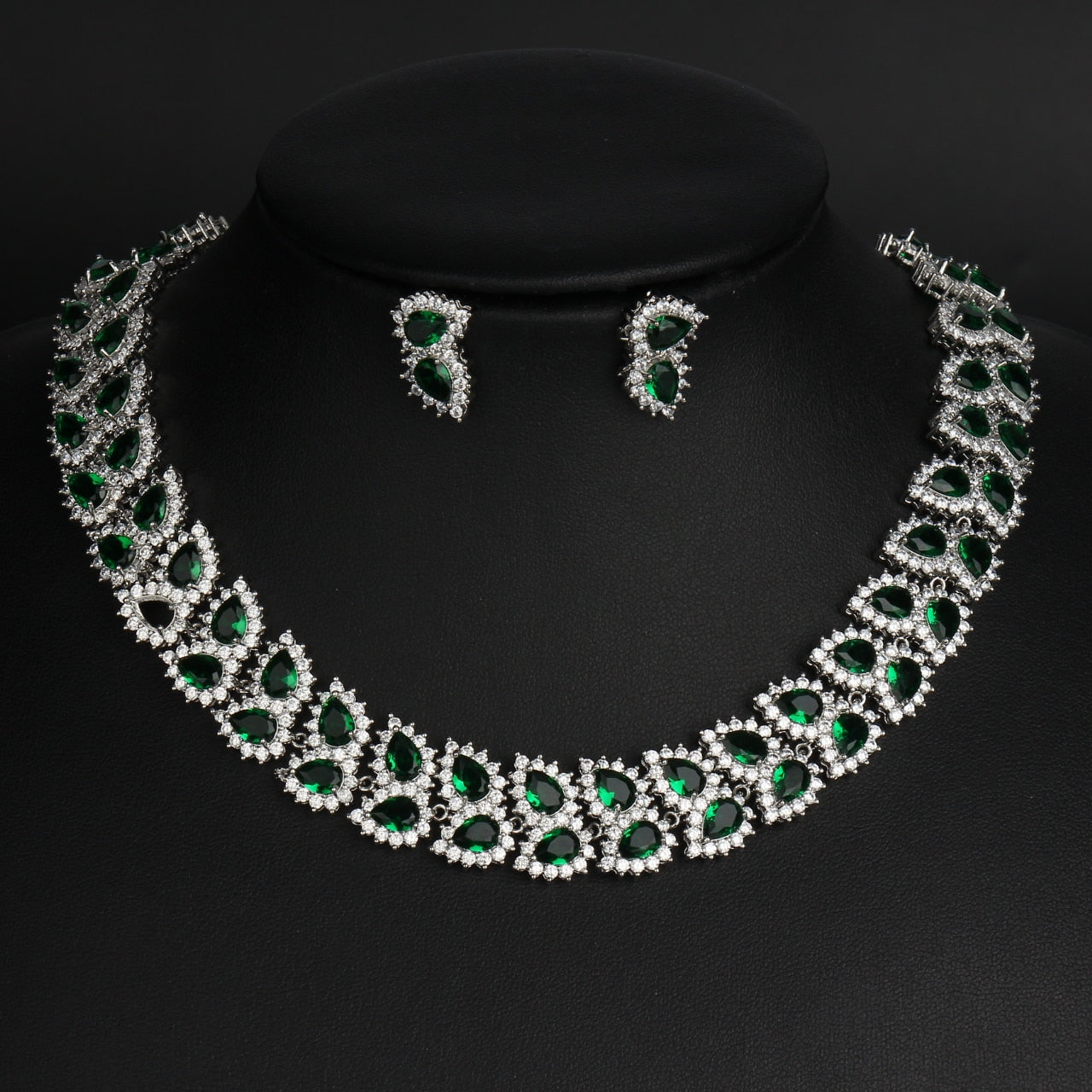 Exquisite Emerald Green Cubic Zirconia Necklace and Earrings Set
 
 Make a stunning statement with this exquisite jewelry set, featuring a captivating emerald green cubic zircon necklace and earrings. Whether you're attending a wGlam DuchessGlam DuchessExquisite Emerald Green Cubic Zirconia Necklace