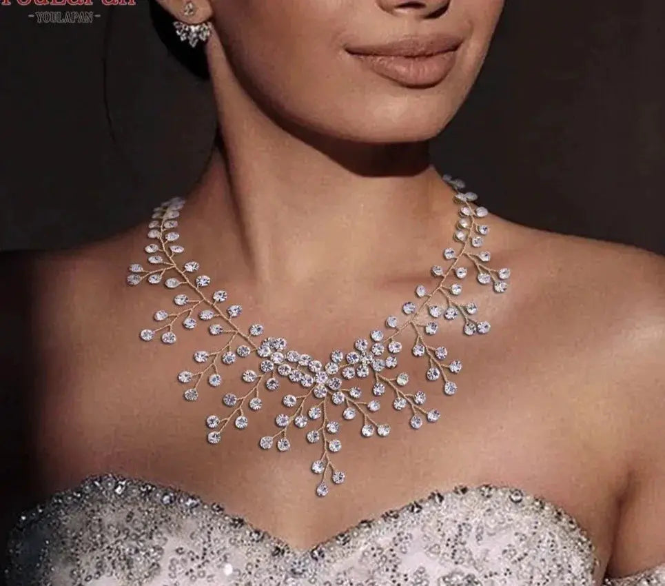 Crystal bridal necklace with iridescent water-drop pendant and cascading rhinestones.