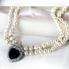 Elegant White Pearl Necklace with Blue Crystal Heart Pendant