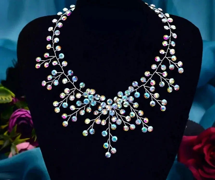 Iridescent crystal bridal necklace with branching strands and a water-drop pendant, handcrafted modern wedding choker.