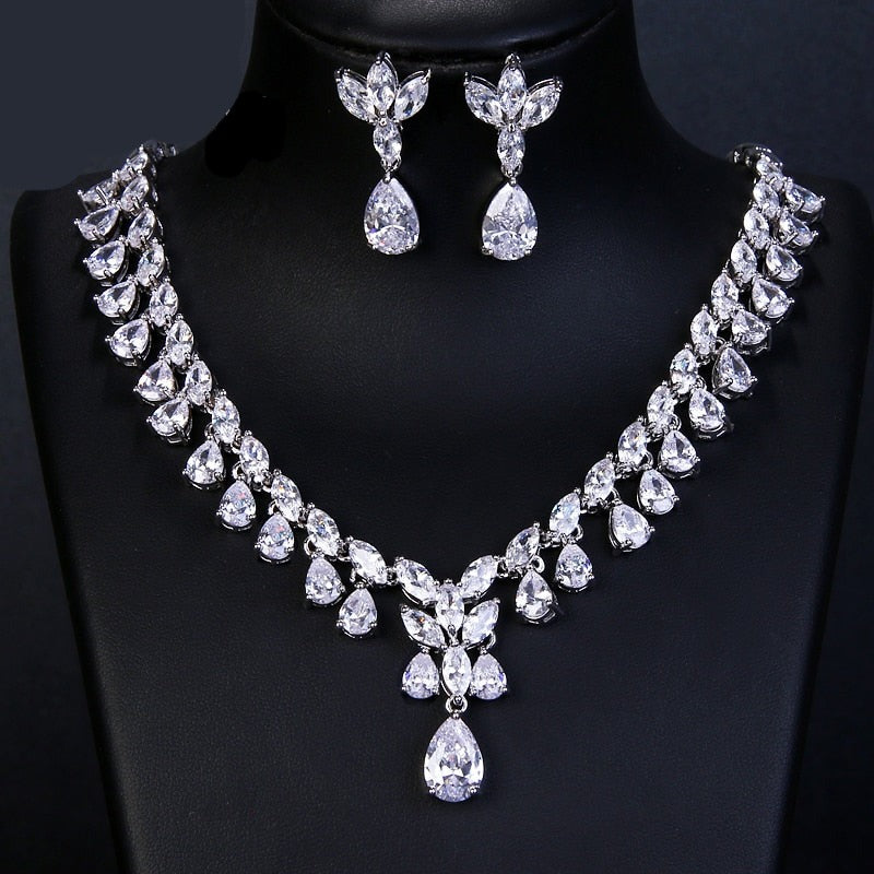 Cubic Zirconia Drop Necklace and Earrings Set with Plant-Inspired Desi
 
 Make a statement at any occasion with this trendy and elegant jewelry set. Crafted from high-quality copper and adorned with sparkling cubic zirconia, this set iGlam DuchessGlam DuchessCubic Zirconia Drop Necklace