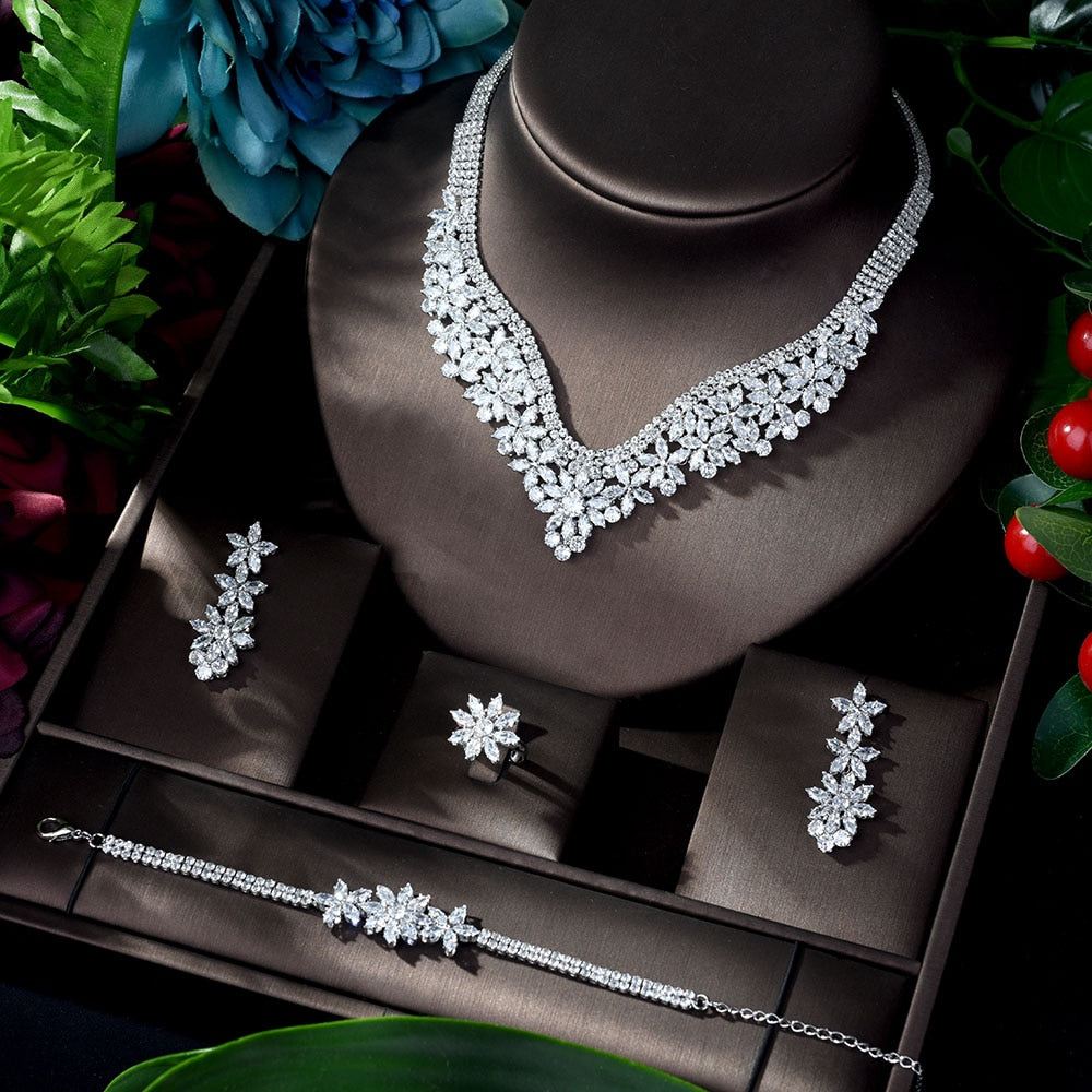 Elegant 4-Piece White Cubic Zircon Wedding Jewelry Set  This exquisite wedding jewelry set offers a touch of glamour and sophistication to your special day. Crafted with attention to detail, the set includes:  1 st0Glam DuchessGlam DuchessElegant 4-Piece White Cubic Zircon Wedding Jewelry Set